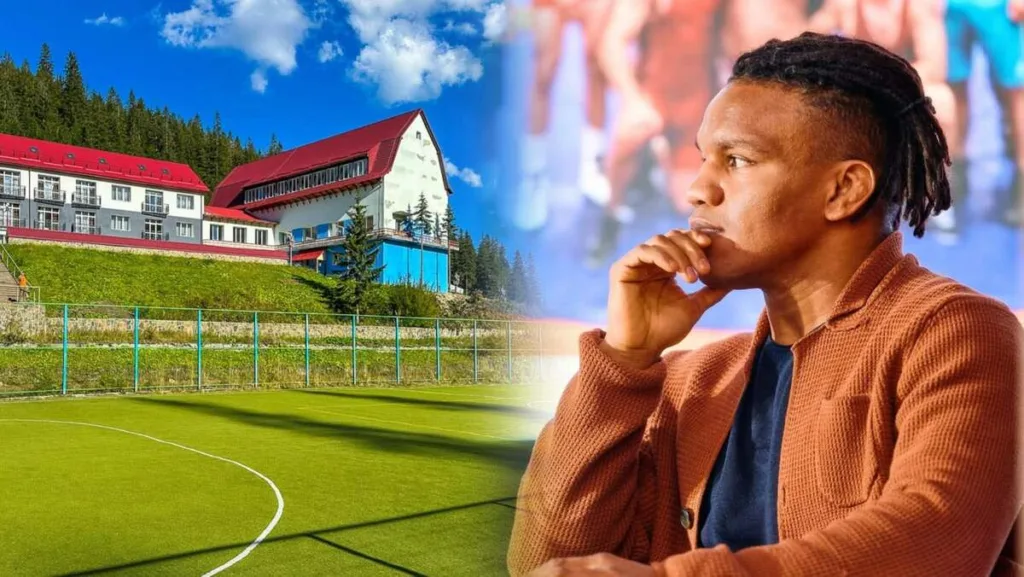 Чоловік розмірковує біля спортивної бази в горах