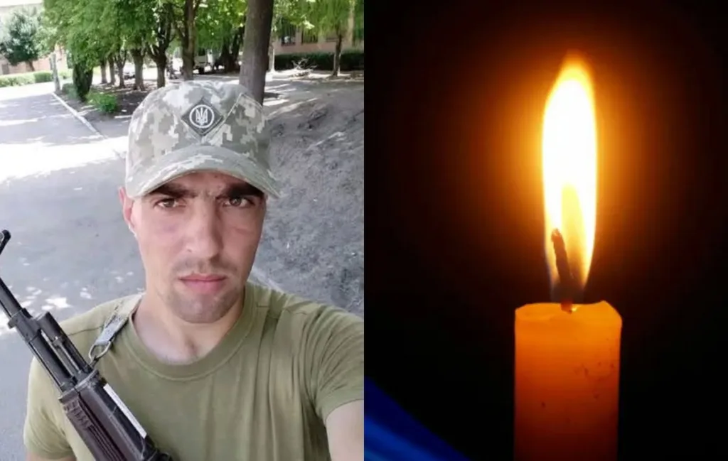 Військовий з автоматом і палаюча свічка пам’яті