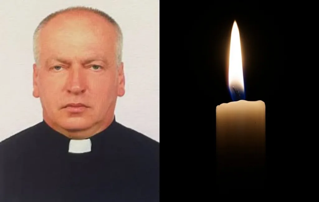 Священник і запалена свічка пам’яті