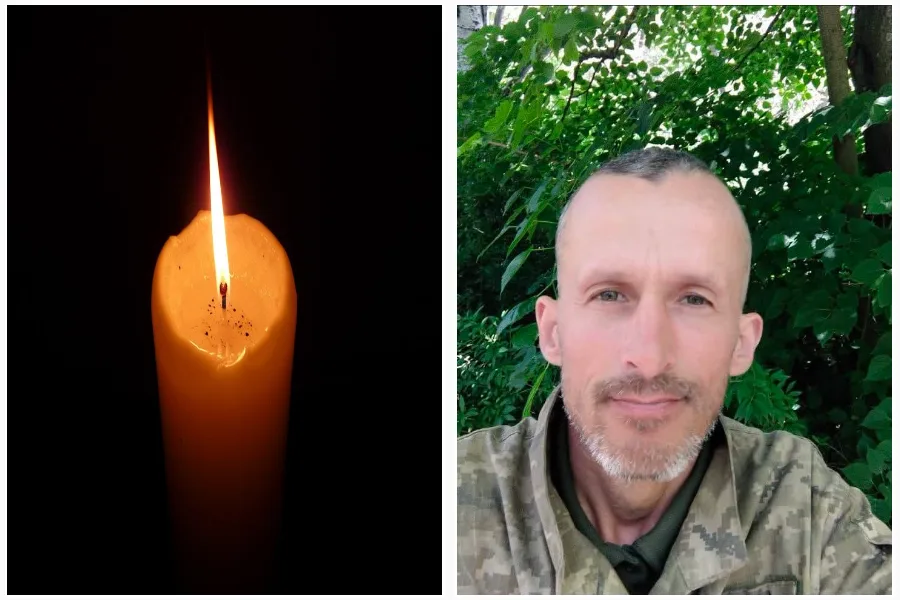 Свічка пам’яті поруч із портретом військовослужбовця