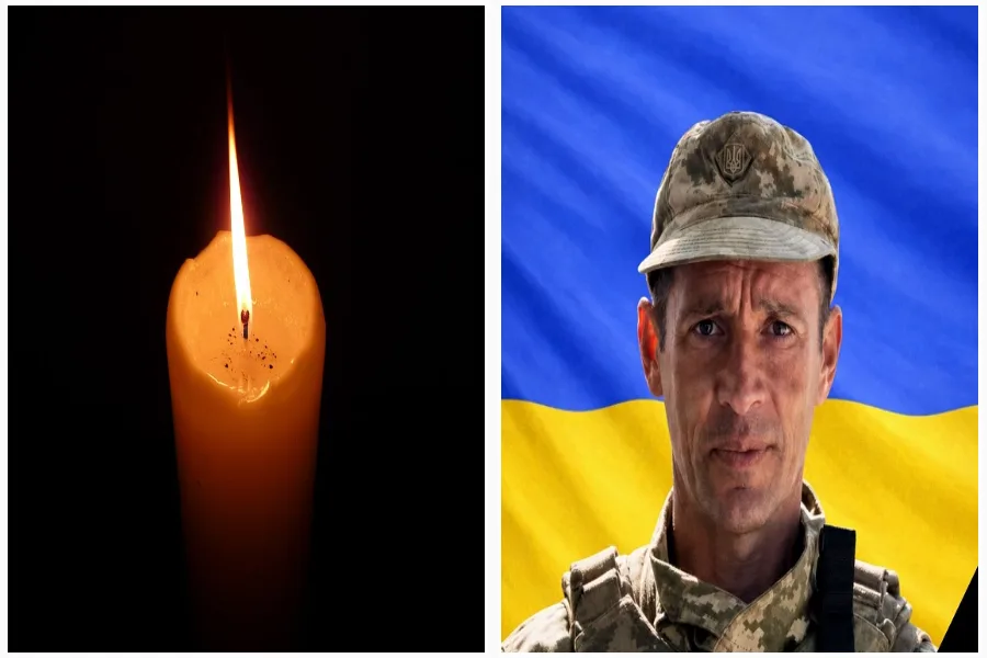 Свічка пам’яті та український військовий на тлі прапора