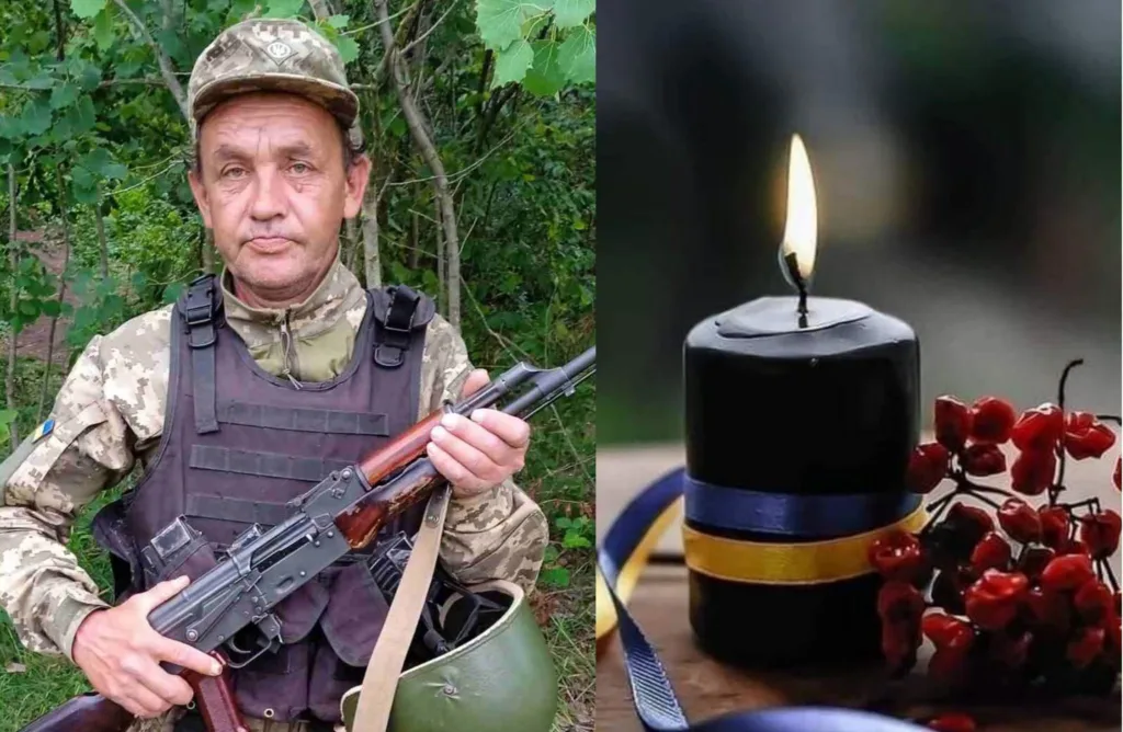 Військовий з автоматом поруч із поминальною свічкою