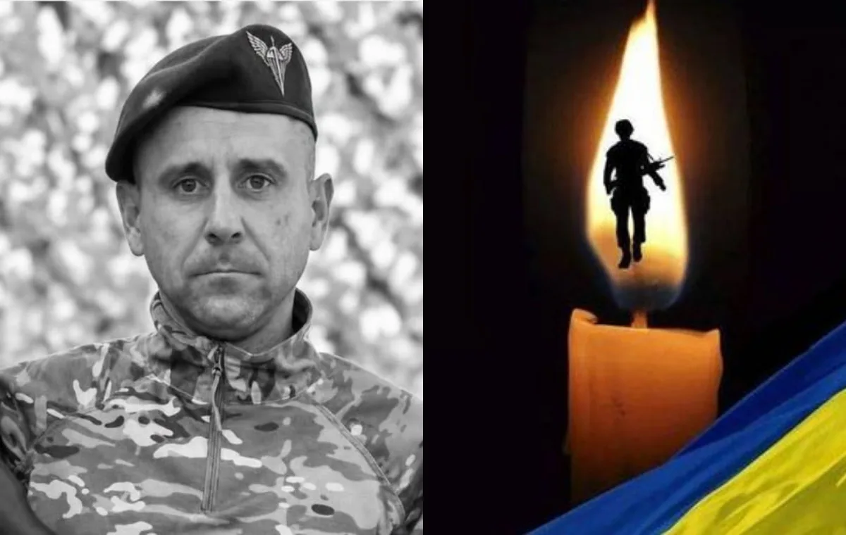 Портрет військового, свічка та український прапор