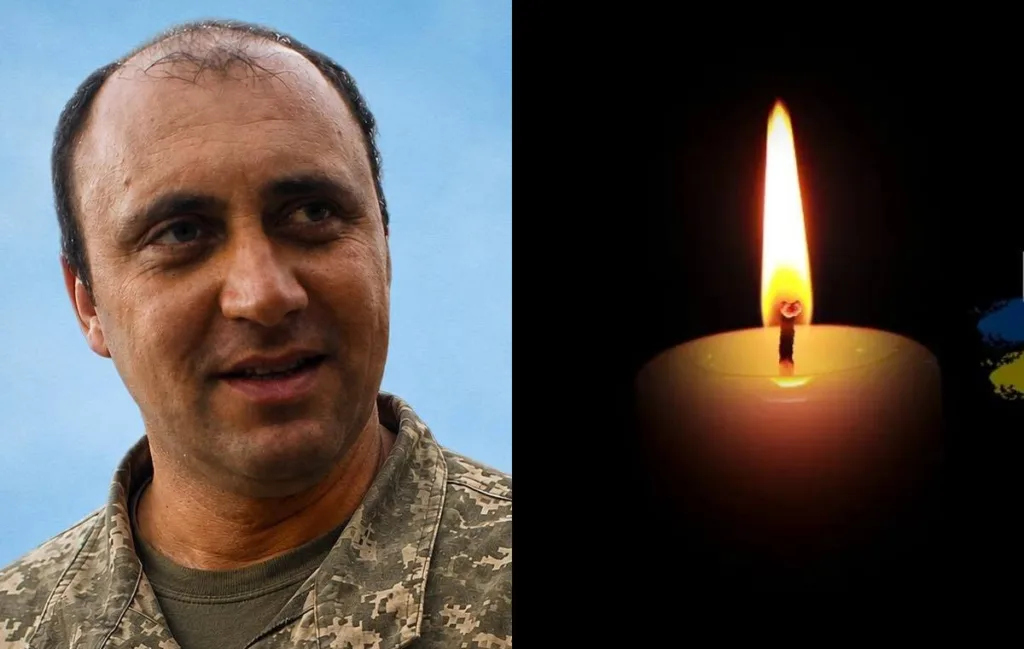 Портрет військового поруч із запаленою поминальною свічкою