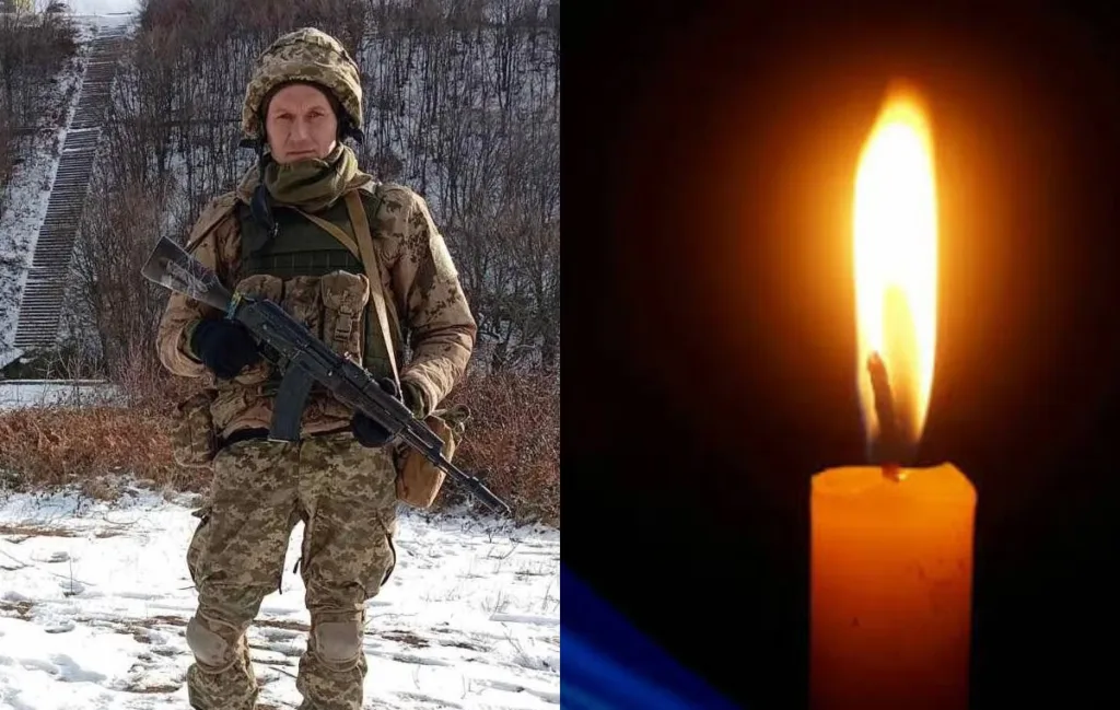 Військовий зі зброєю поруч із запаленою свічкою