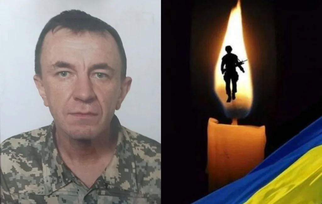 Портрет військового, свічка пам’яті та прапор України