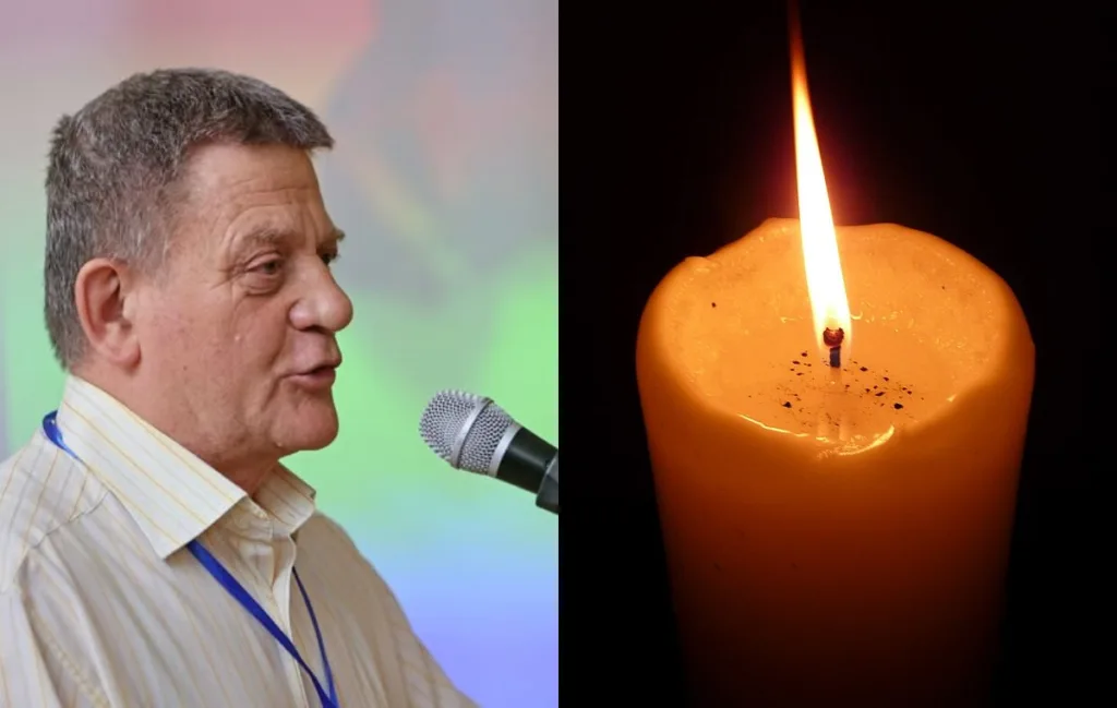 Чоловік біля мікрофона поруч із запаленою свічкою